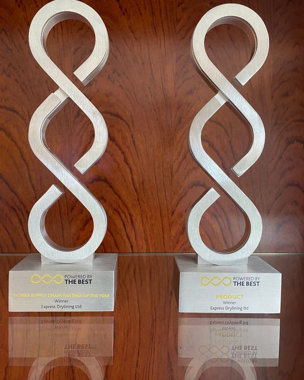 Two Willmott Dixon supply chain award trophies